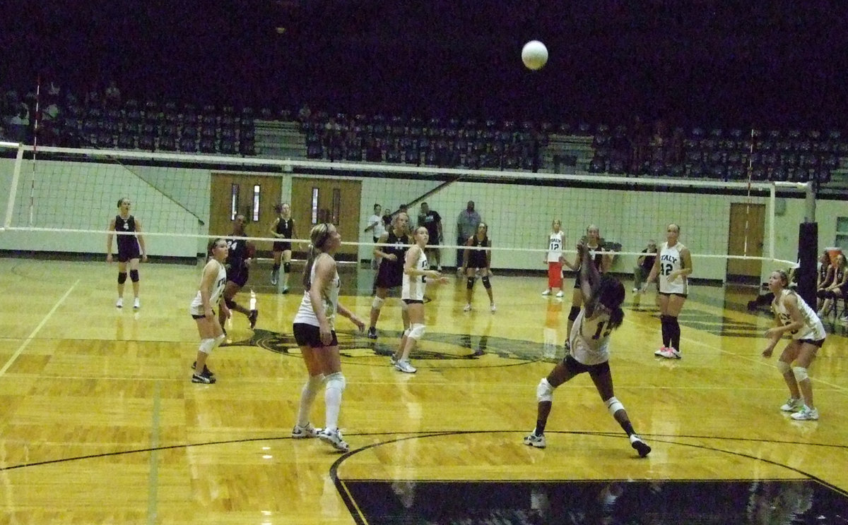 Image: Johnson responds — Kortnei Johnson (15) handles whatever comes over the net.