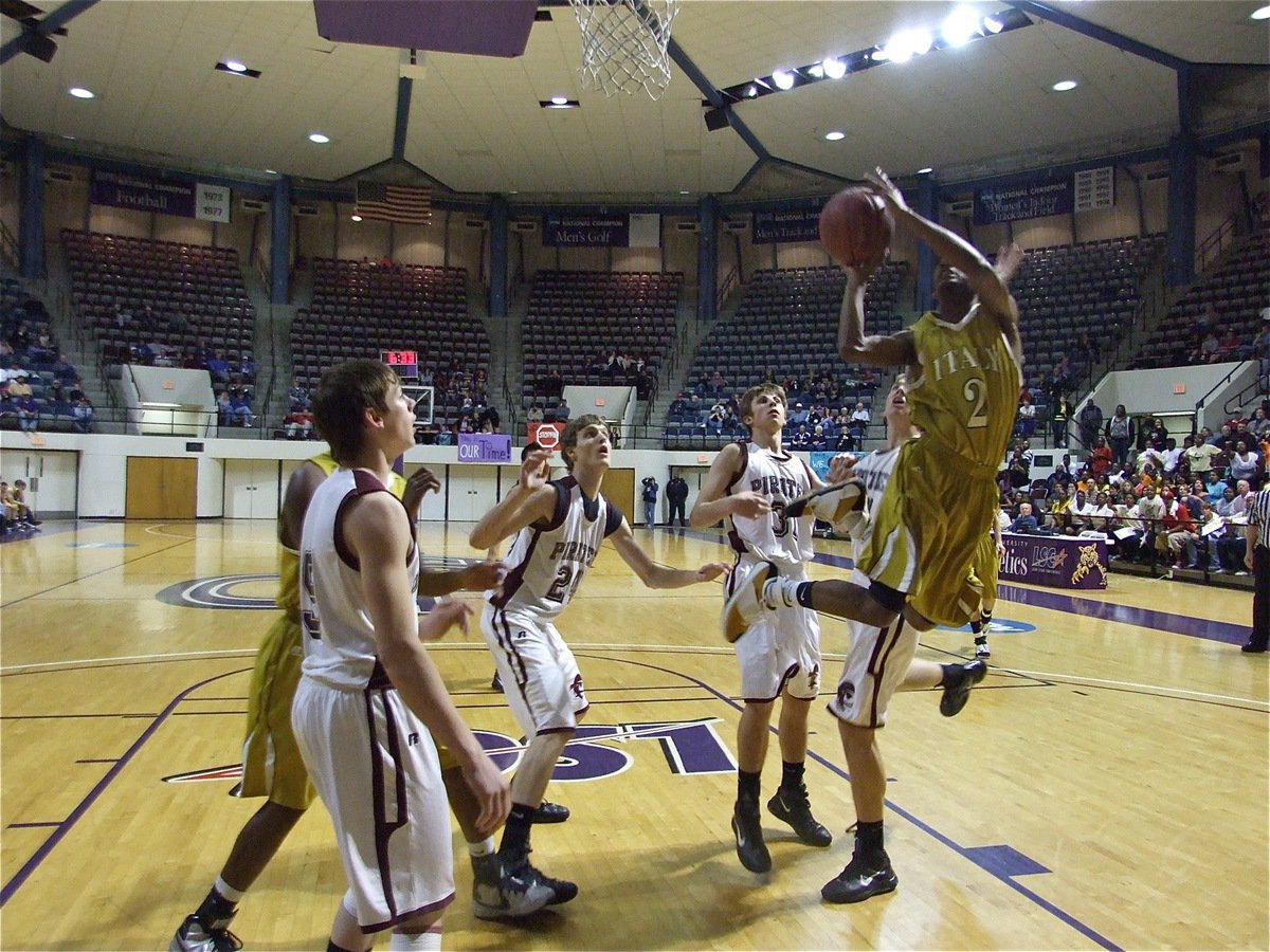 Image: Snoop gets thru — Heath Clemons overcomes the Pirate height advantage with athletic prowess to score.