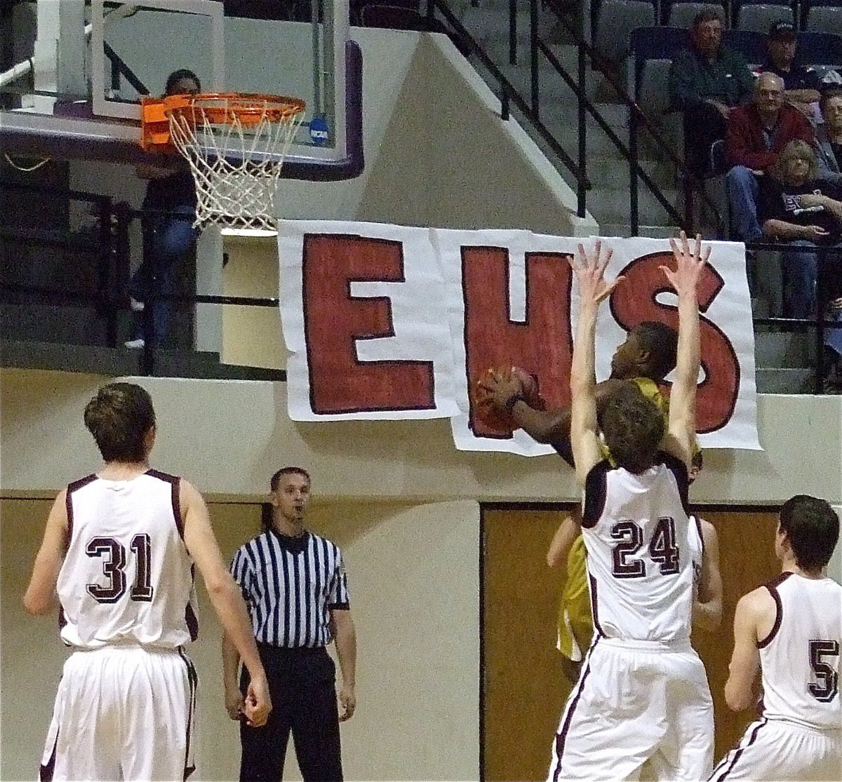 Image: Up and in — Jasenio Anderson times his jump for 2-points to out leap 6’ 5" Kainon Irons.