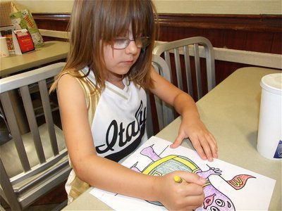 Image: Catie can color — Catie South did a perfect job coloring Grimace during IYAA Sports Night.