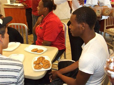 Image: Cookie Contest time — De’Andre Sephus meditates before beginning the cookie eating contest.
