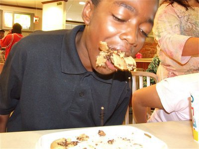 Image: The Cookie Kid — Kendrick Norwood has a mouthful of chocolate chip cookies during the cooking eating contest.
