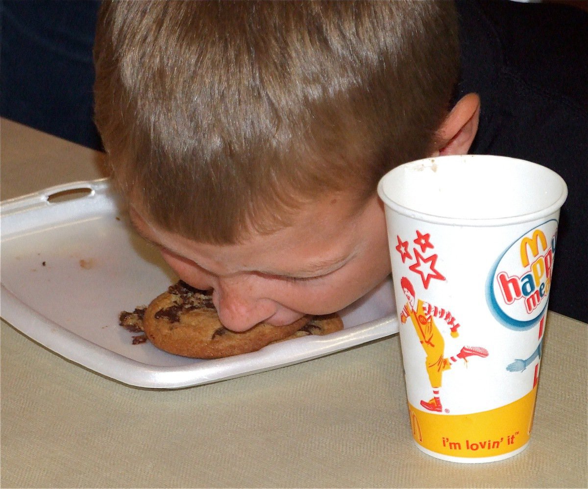 Image: Bryce…Breathe! — Bryce DeBorde tries to chomp down on some chocolate chips.