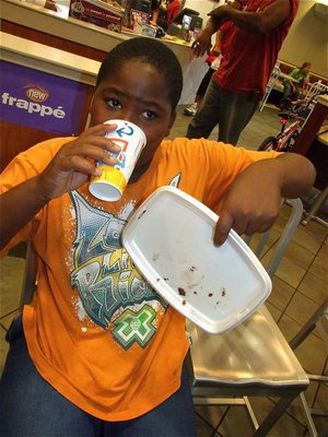 Image: I need a drink — Kenneth Norwood cleans his plate to win one of the cookie eating contests.