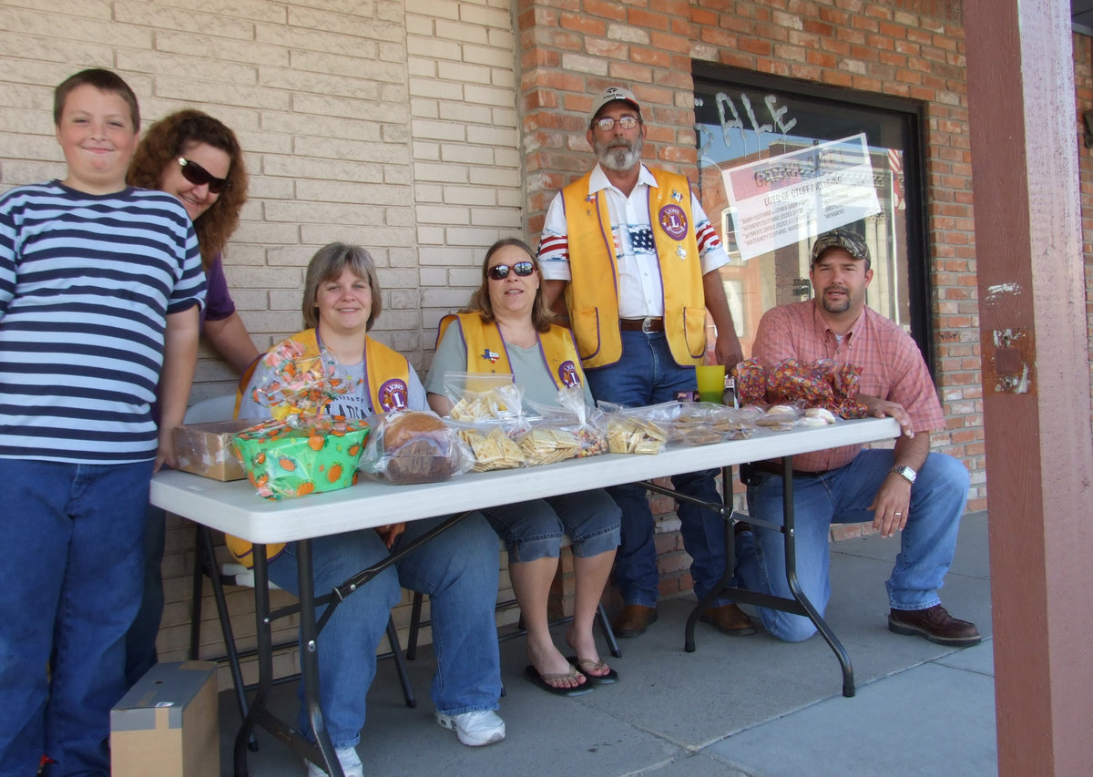 Image: Lions Club bake sale — Austin Pittmon, Meg Lyons, Holly Pittmon, Kristi Souder, Mark Souder Sr. and Mark Souder Jr. hard at work raising money for Italy ISD graduating seniors scholarship fund by selling bake goods.