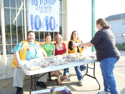Image: Lions Club fundraiser — Arval Gowin and his team of helpers selling baked goods to help our Italy senior graduating class.
