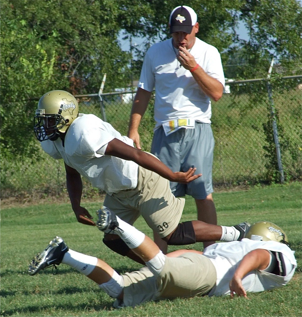 Image: Technique — Jalarnce Jamal Lewis works on avoiding a blocker.