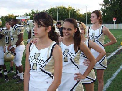 Image: Can you see? — IHS Cheerleaders Beverly Barnhart, Anna Viers, Mary Tate and Kaitlyn Rossa get in line for the National Anthem.