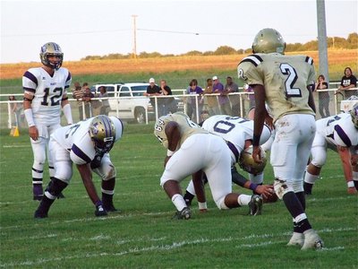 Image: I see you — Defensive lineman Bobby Wilson(64) digs in as teammate Heath Clemons(2) keeps a close watch on the Panther’s backfield.