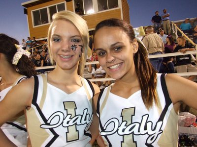 Image: Sierra and Anna — IHS Cheerleaders Sierra Harris and Anna Viers show no signs of worry during the game.