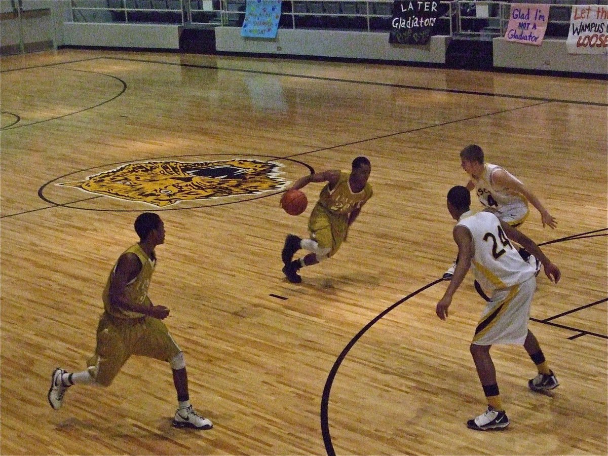 Image: Sephus drives — De’Andre Sephus dribbles into the teeth of the Wampus Cat defense with a Heath Clemons(2) riding the wing.