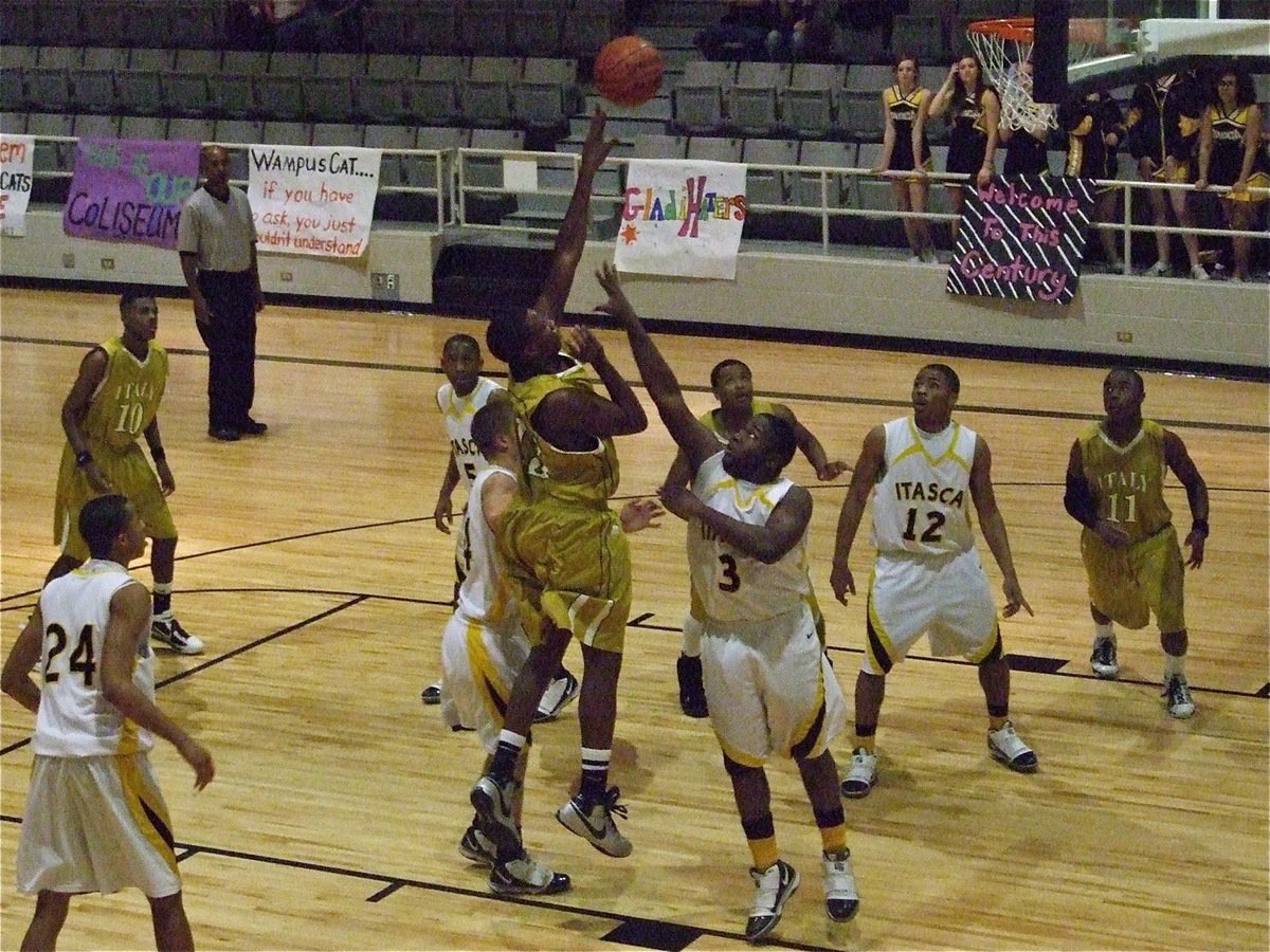 Image: Go, Big Baby! — Larry “Big Baby” Mayberry(13), only a sophomore, elevates over the Cats for a score.