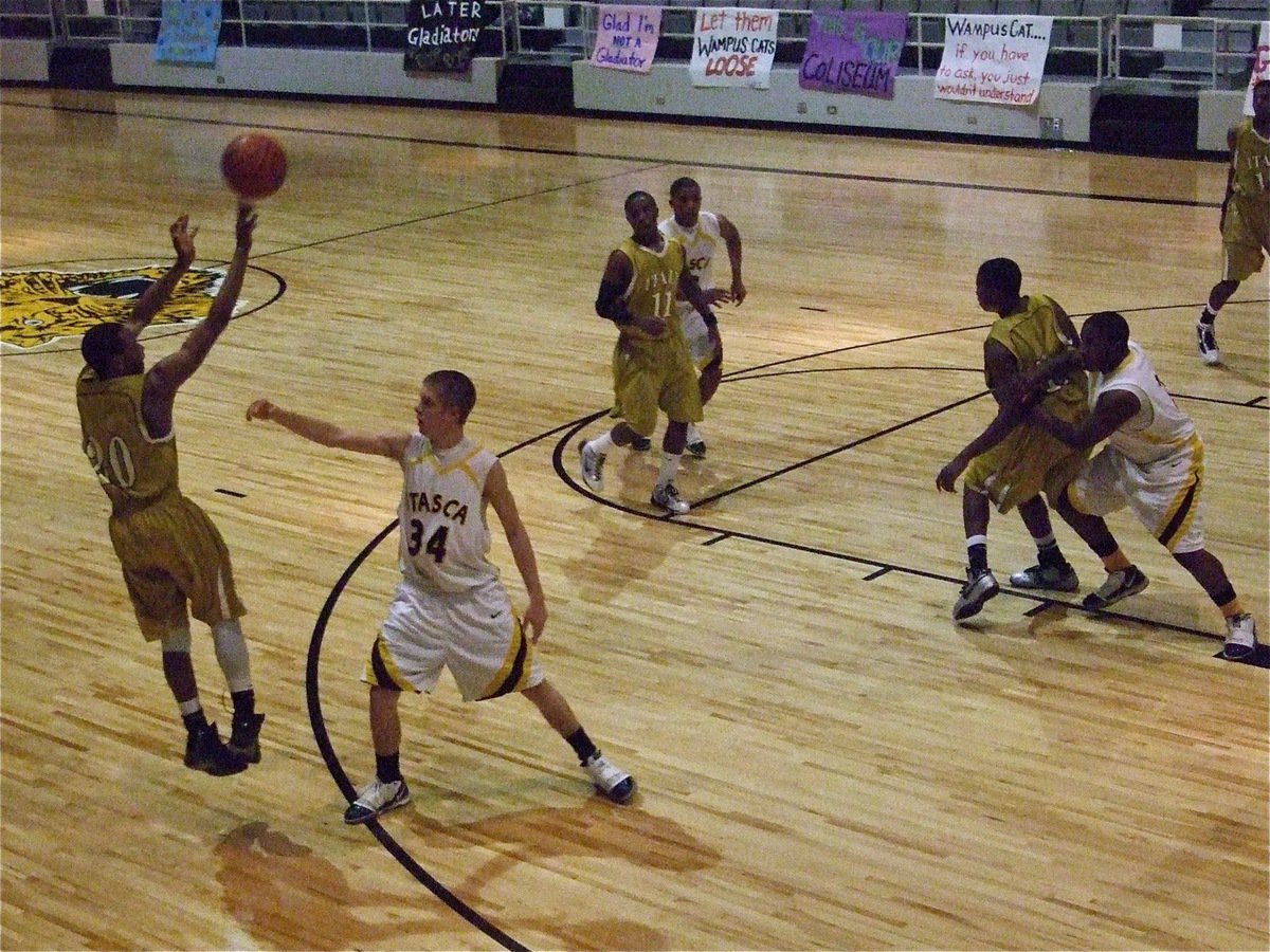 Image: Sephus for 3 — De’Andre Sephus(20) pops a 3-pointer during the game.