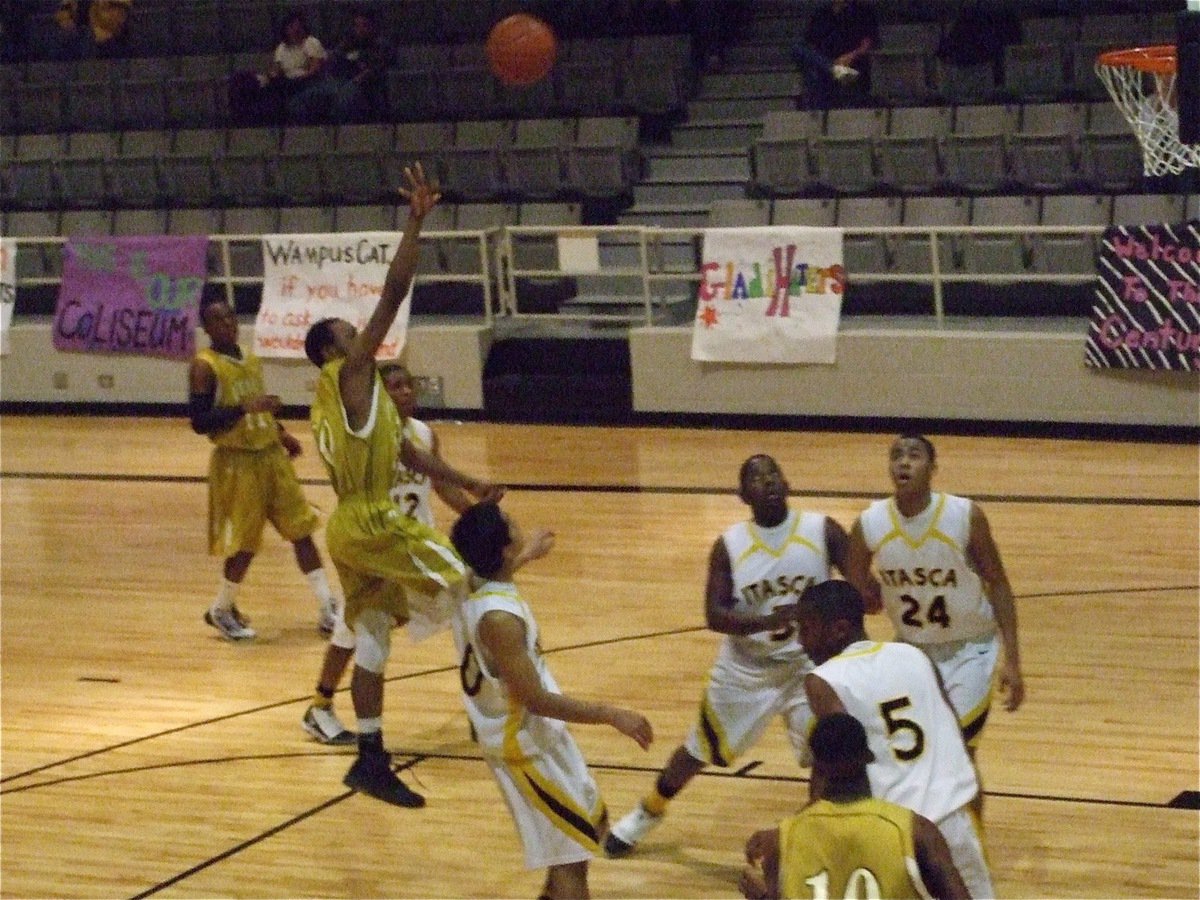 Image: Sephus soars — De’Andre Sephus(20) tries to loft a shot over the Itasca defense.