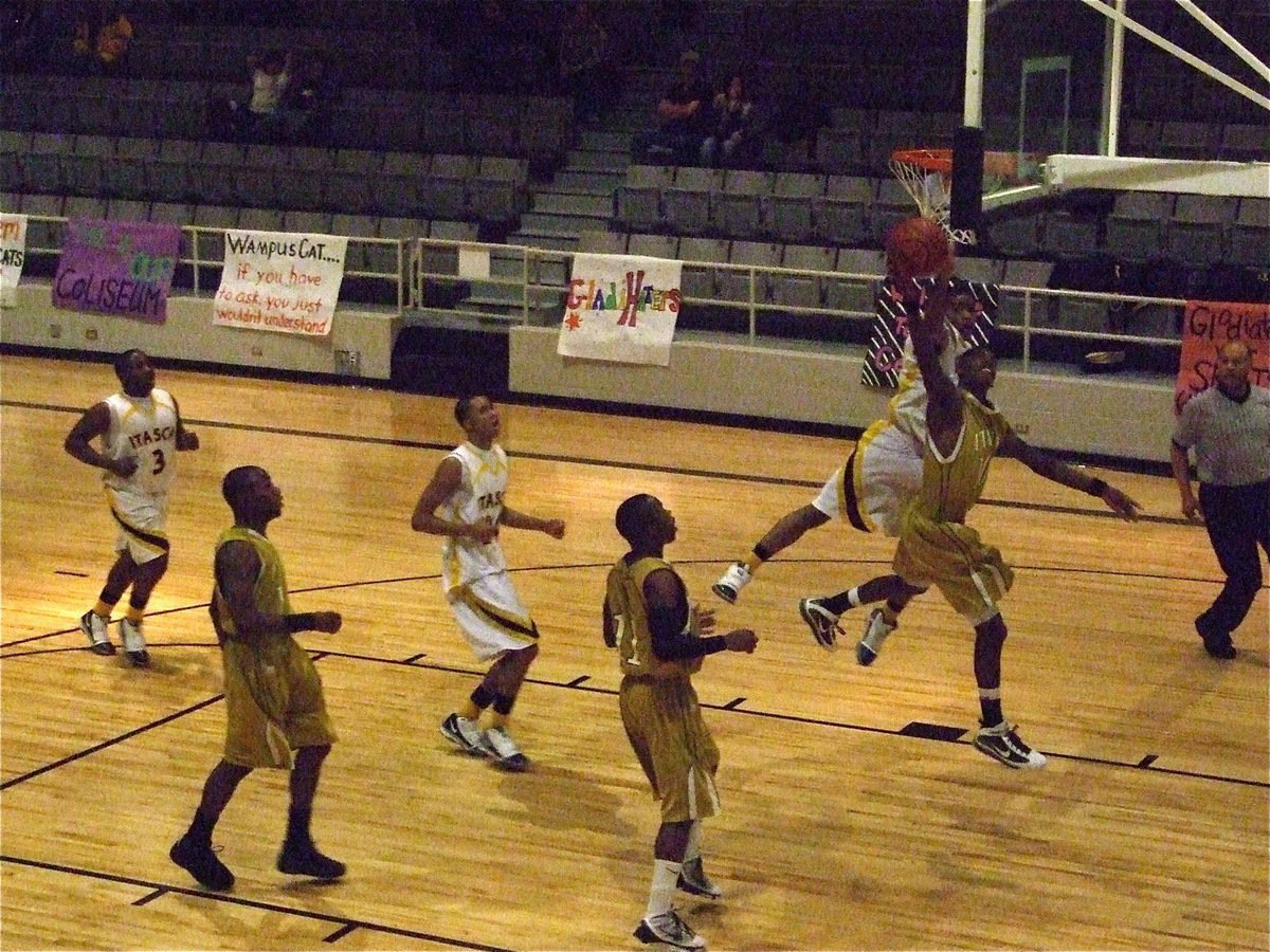 Image: Isaac astounds — Italy gets the Wampus Cat off their back as John Isaac(10) goes opposite side of the rim to score a layup. Italy won both district games against Itasca this season.