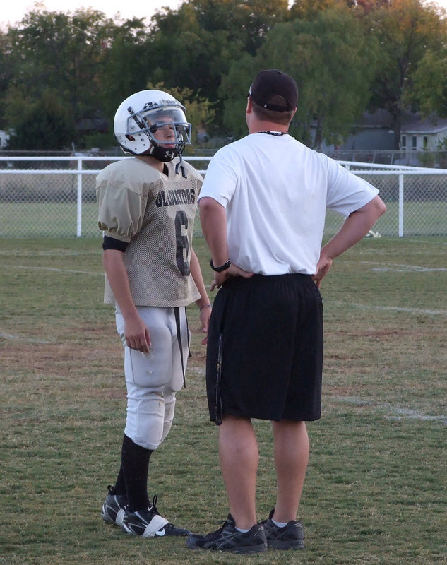 Image: Wooldridge and Coach Ward — Discussing the plays.