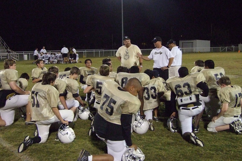 Image: After the game talk — Coach Ward telling the boys they did a good job.