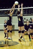 Image: Over the top — Kaitlyn Rossa(3) and Bailey Bumpus(8) continue to get the job done for the Lady Gladiators.