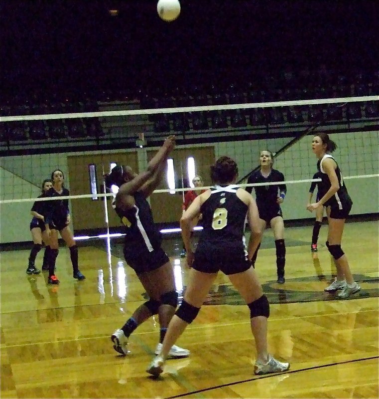 Image: “Burk” bumps it — Brianna Burkhalte(13) bumps the ball back to Rice.