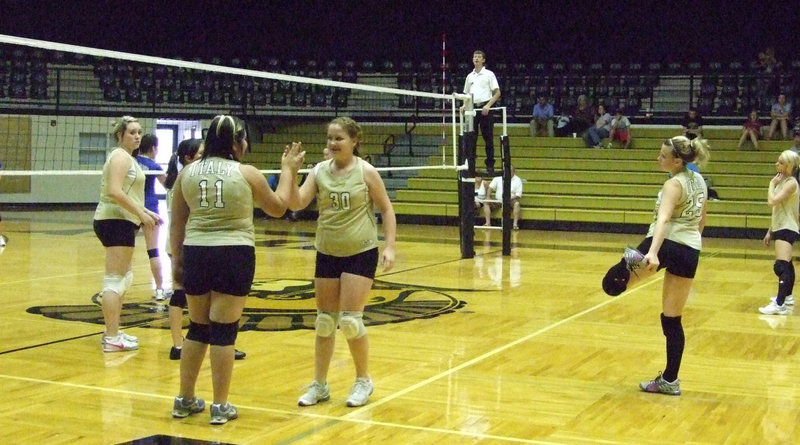 Image: Ready to play — Monsi Figueroa (11) and Paige Westbrooke’s (30) exchange places during the game.