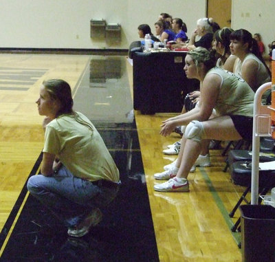 Image: Coach Reeves oversees — Reeves and the Lady Gladiators work hard every game.