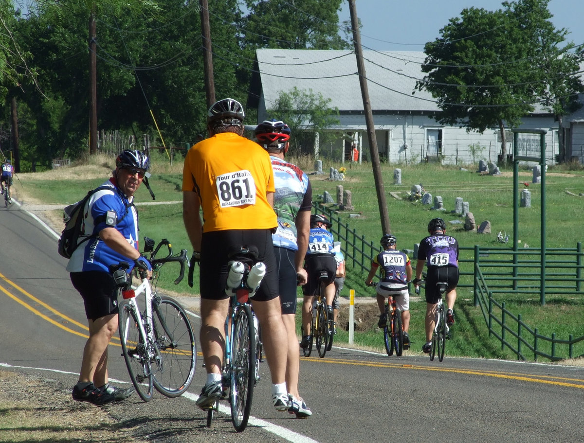 Image: Frost rest stop — Frost has long since been a rest stop of the cyclists that include water, fruit and wonderful music from Carl “Elvis” Cassidy.