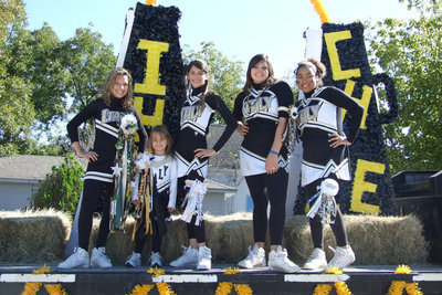 Image: IHS Cheerleaders — Junior and Senior High Cheerleaders had a float.