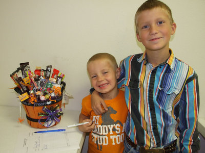 Image: Kids excited about candy — Blake Oliver and Dakota Threadgill were bidding $1,000 on that candy basket.