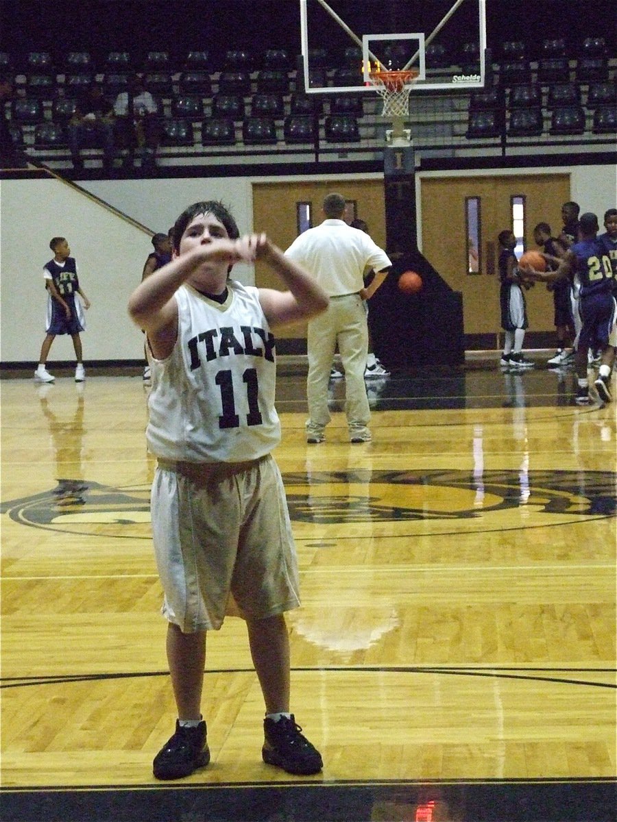 Image: Kyle at the line — Kyle Fortenberry(11) practices a free throw before the 7th grade game.