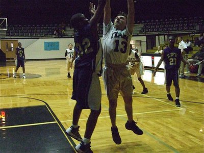Image: Chace shoots — Chace McGinnis(13) goes up for a shot against Dallas Gateway.