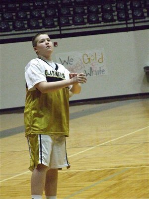 Image: Tristan practices — Tristan Smithwick practices his jump shot before the game.