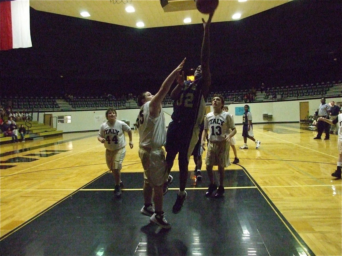 Image: Kelton defends — Kelton Bales(55) pressures a Dallas Life shooter as John Byers(44) and Chace McGinnis(13) look for a rebound.