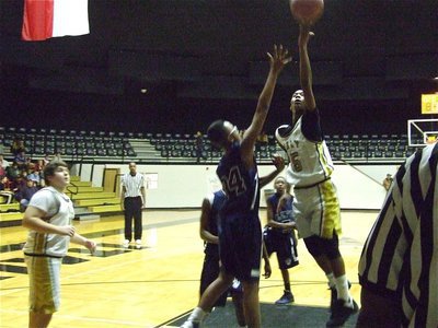 Image: Treyvon gets to the rim — Kevin Roldan(41) get in rebounding position as Treyvon Robertson lays it in over Dallas life.
