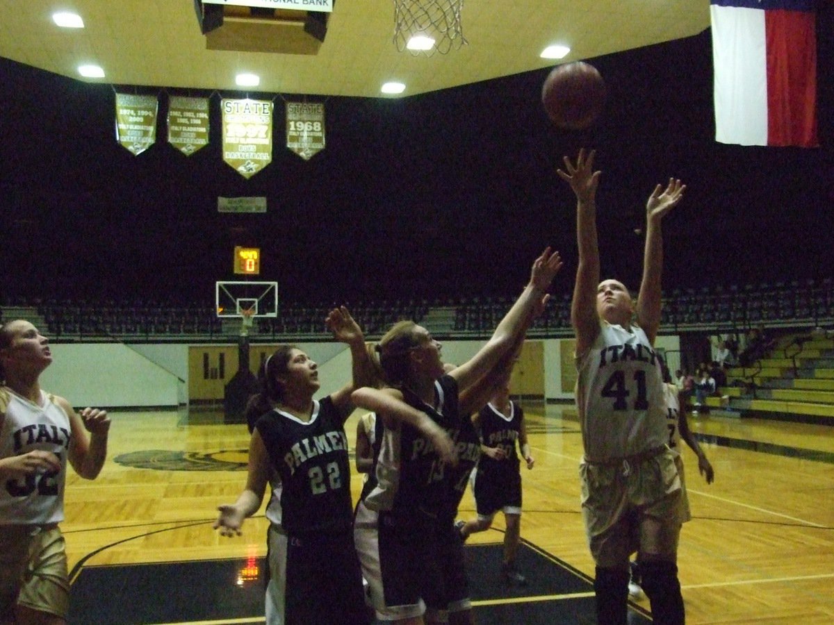 Image: Jaclynn inside — Wearing Dirk Nowitzki’s #41, Jaclynn “The Blonde Bomber” Lewis makes it look easy.