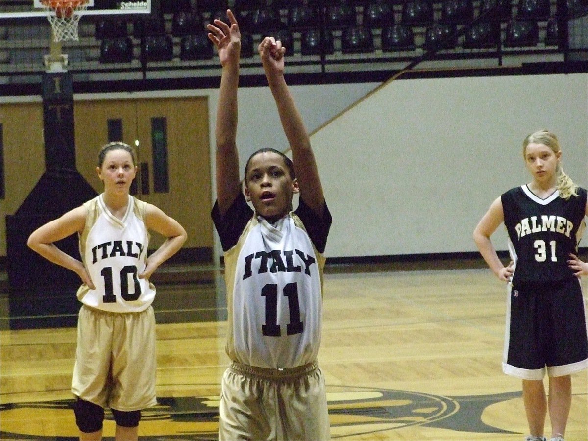 Image: Alex concentrates — Alex Minton(11) takes a free shot at Palmer as Bailey Eubank(10) waits for the result.