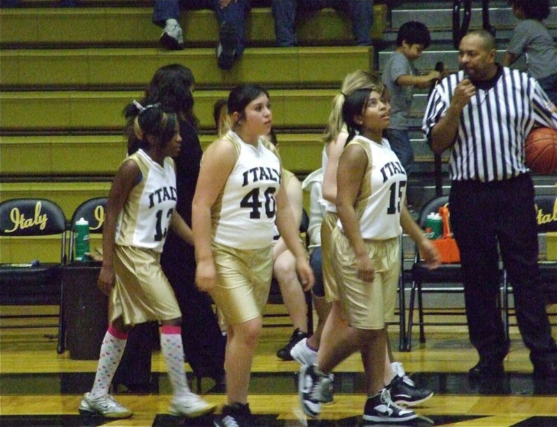 Image: Glancing up — Ashley Harper(15) takes a quick glance up at the scoreboard as Italy’s 8th grade girls return to action late in the game.