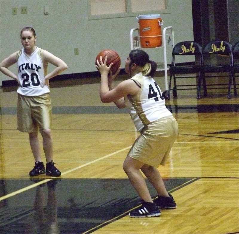 Image: Figueroa from the line — Monserrat Figueroa(40) attempts free throws as Jesica Wilkins(20) catches her breath.