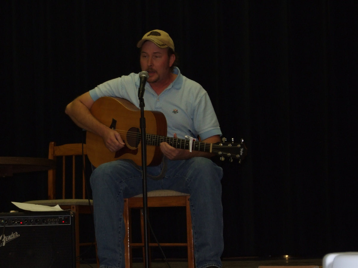 Image: Billy Ewing — Billy Ewing singing for the crowd.