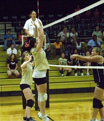 Image: Defending the dome — Taylor Turner and Paige Westbrook form a wall at the net.