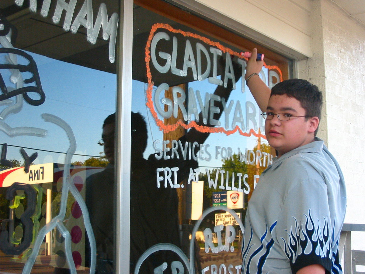 Image: Andrew Jones helps Byers — Andrew Jones helps Barry Byers with the windows at the Cornerstone on Main Street.