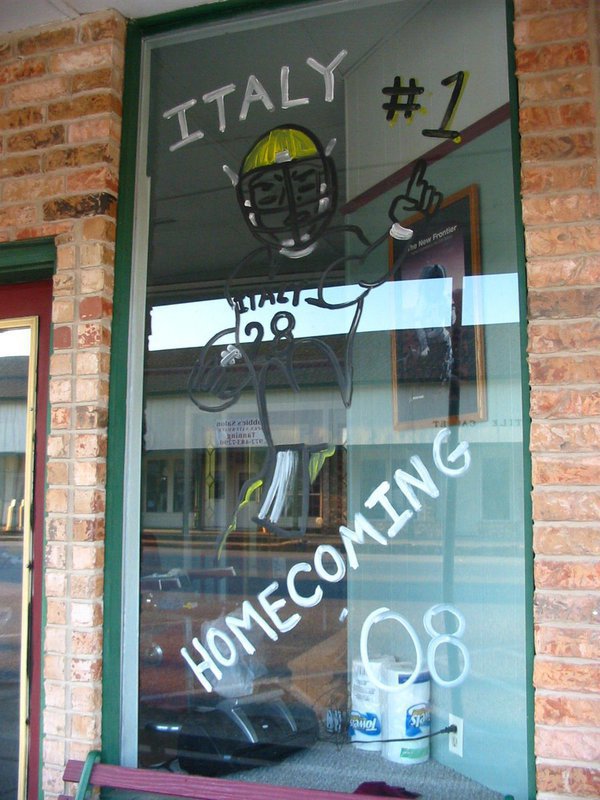 Image: Windows at Barber Shop — Jeff Jaynes, 1959 IHS graduate, is proud to support the Gladiators at his new barber shop on Main Street.