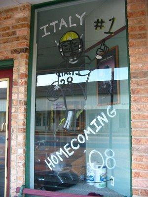 Image: Windows at Barber Shop — Jeff Jaynes, 1959 IHS graduate, is proud to support the Gladiators at his new barber shop on Main Street.