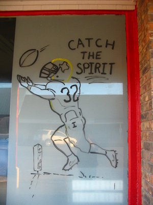 Image: Italy Deli &amp; Antiques — Barry depicts Gladiator Jonathan Nash on the windows at the Italy Deli &amp; Antiques.