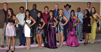 Image: Beautiful young ladies and their escorts — IHS Homecoming Queen nominees, class princesses pause for a picture with their escorts.