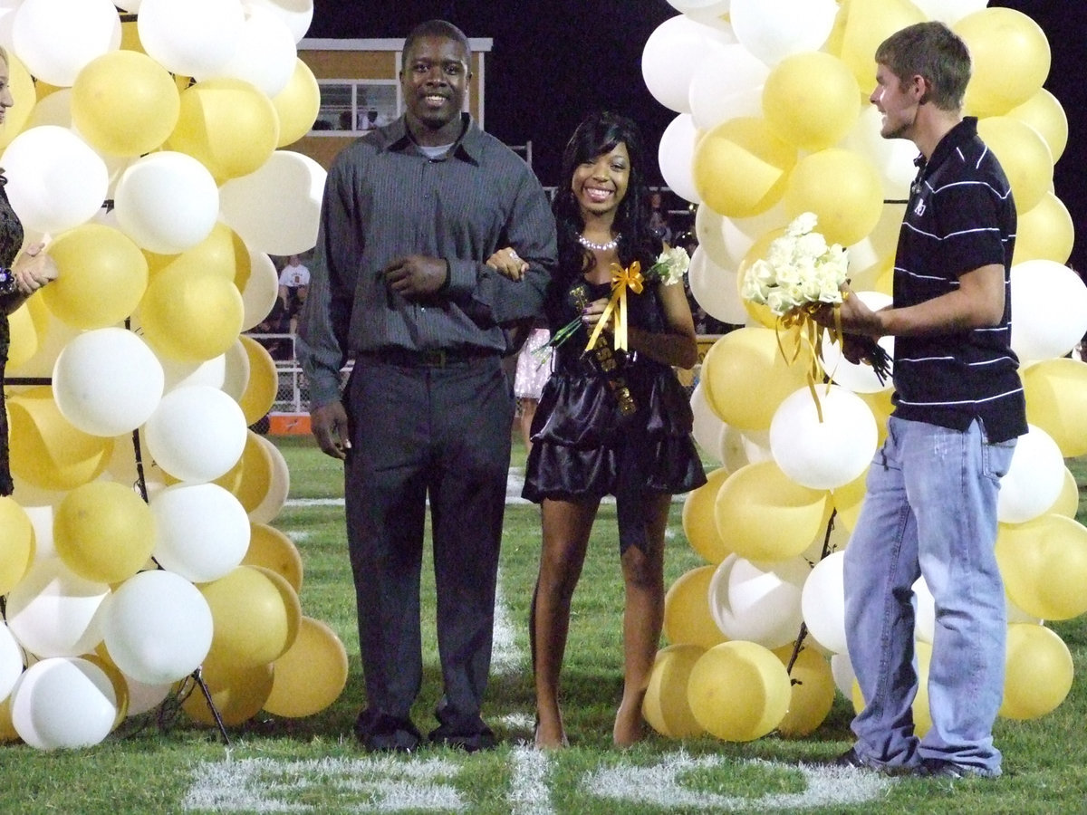 Image: A yellow rose — Ryisha and her escort, Scorpio Babers.