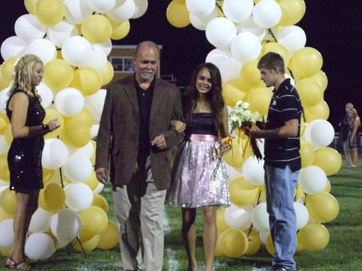 Image: Anna smiles — Anna and her escort, James Viers.