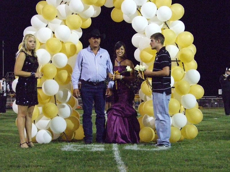 Image: Jessica takes a happy step — Jessica Hernandez and her escort, Pedro Hernandez.