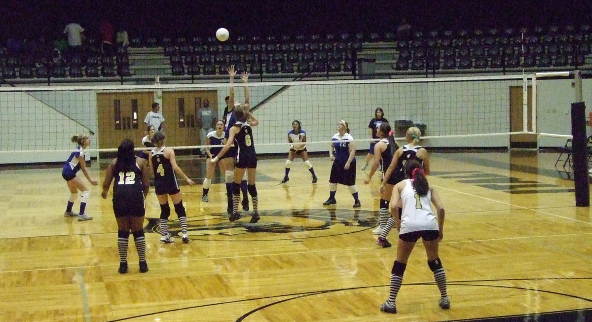 Image: Rossa defends the net — Freshman, Kaitlyn Rossa, working hard at the net.