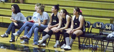 Image: The crew watches on — Coaches Windham and Reeves watch their players lead the battle.