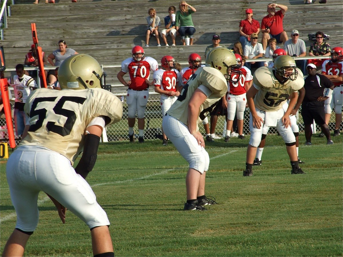 Image: It’s finally here! — Zackery Boykin(55), Jake Escamilla(66) and Bailey Walton(52) get ready for the opening kickoff.